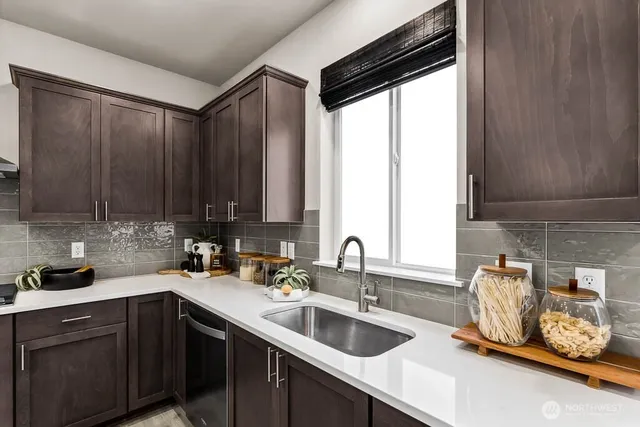 a kitchen with a sink and cabinets