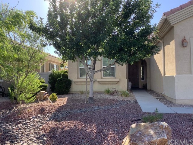 10462 Nobleton Road Apple Valley, CA 92308 - Photo 1 of 1 a view of a house with backyard and a tree