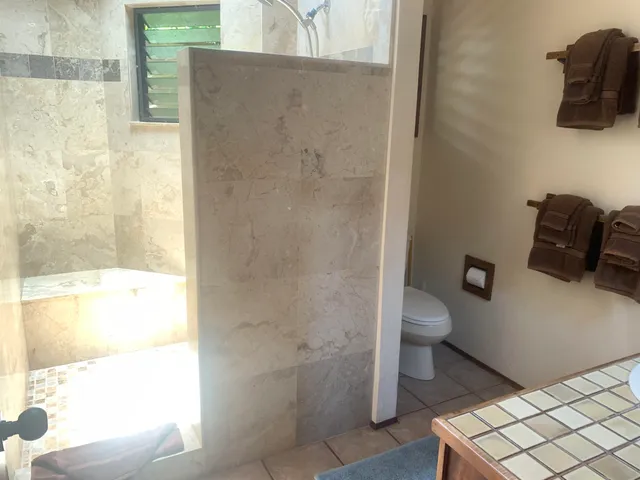 a living room with furniture and lamp