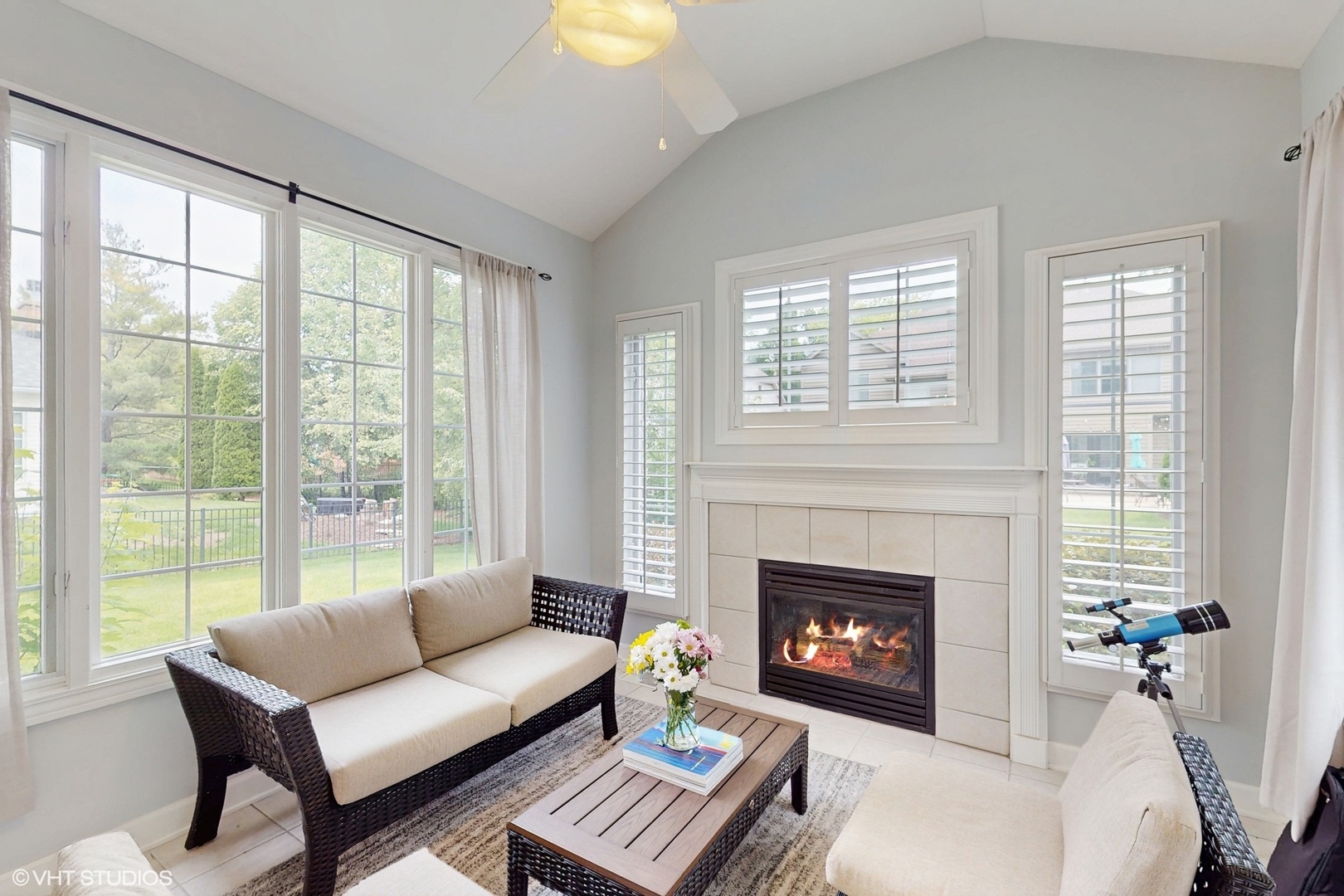 3432 Redwing Drive Naperville, IL 60564 - Photo 18 of 46 a living room with furniture a fireplace and a large window