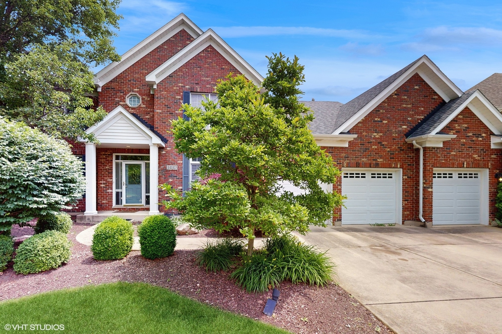 3432 Redwing Drive Naperville, IL 60564 - Photo 2 of 46 a front view of a house with a garden