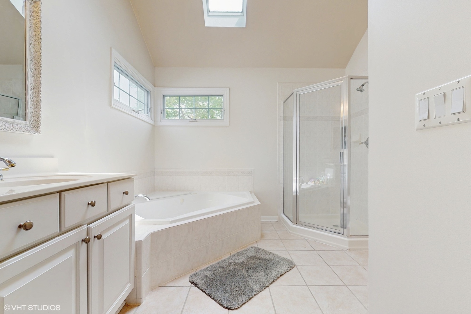3432 Redwing Drive Naperville, IL 60564 - Photo 24 of 46 a bathroom with a tub shower and sink