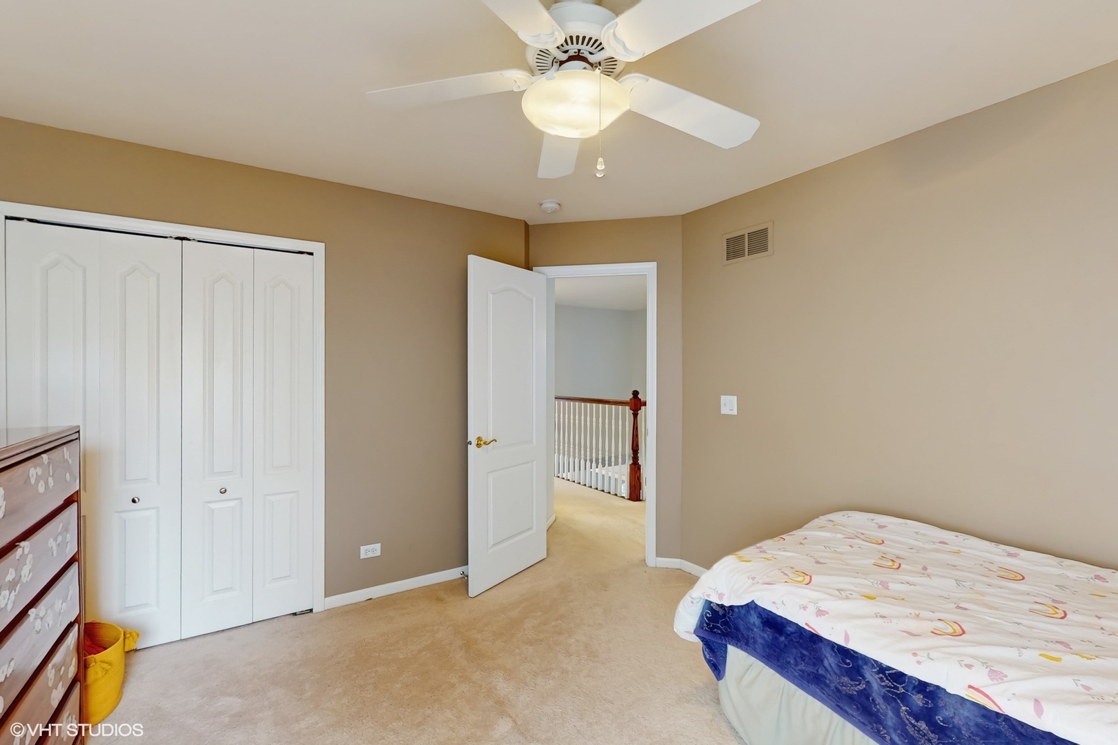 3432 Redwing Drive Naperville, IL 60564 - Photo 29 of 46 a bedroom with a bed and a chandelier