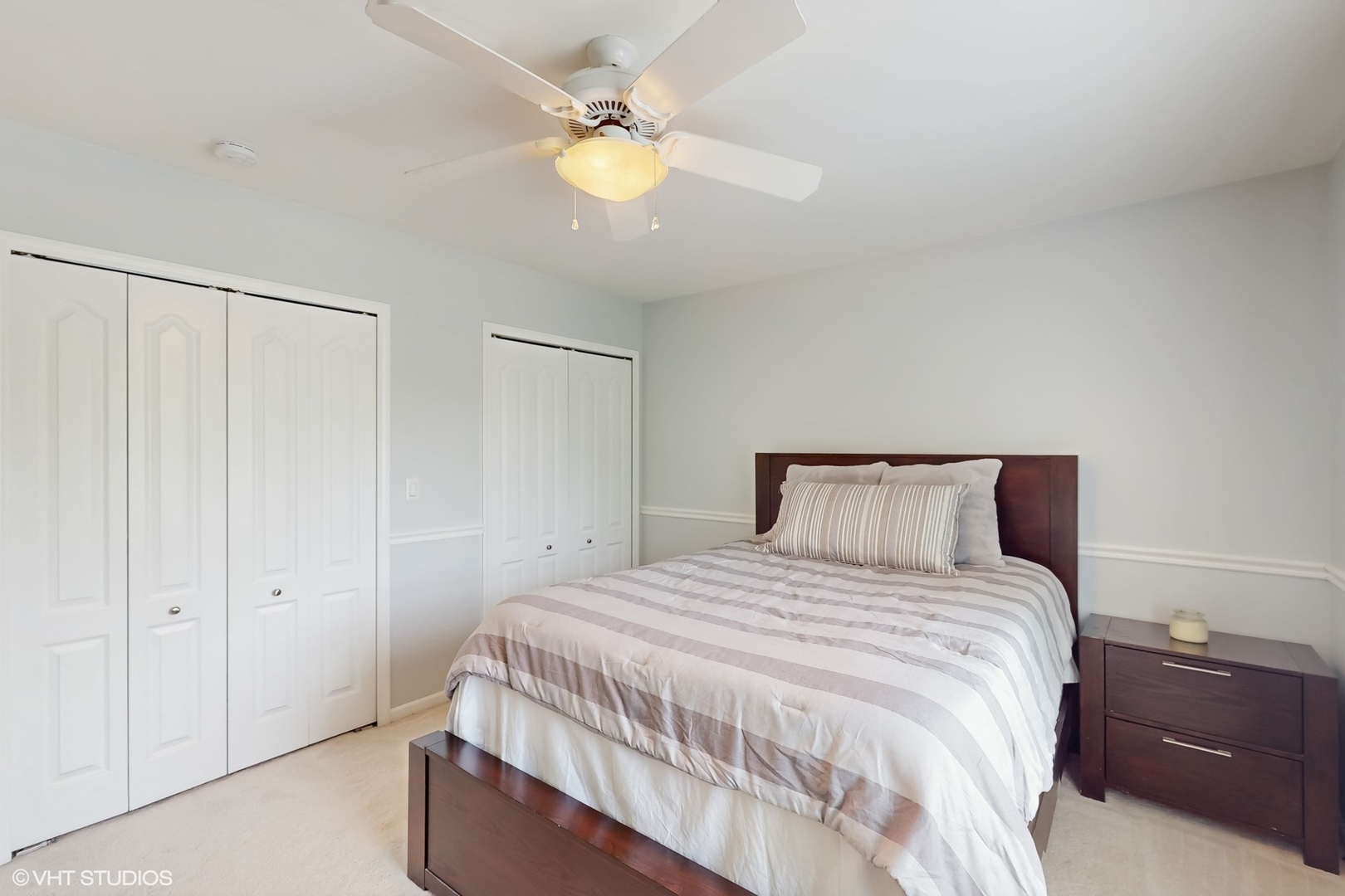 3432 Redwing Drive Naperville, IL 60564 - Photo 31 of 46 a bedroom with a bed and a chandelier