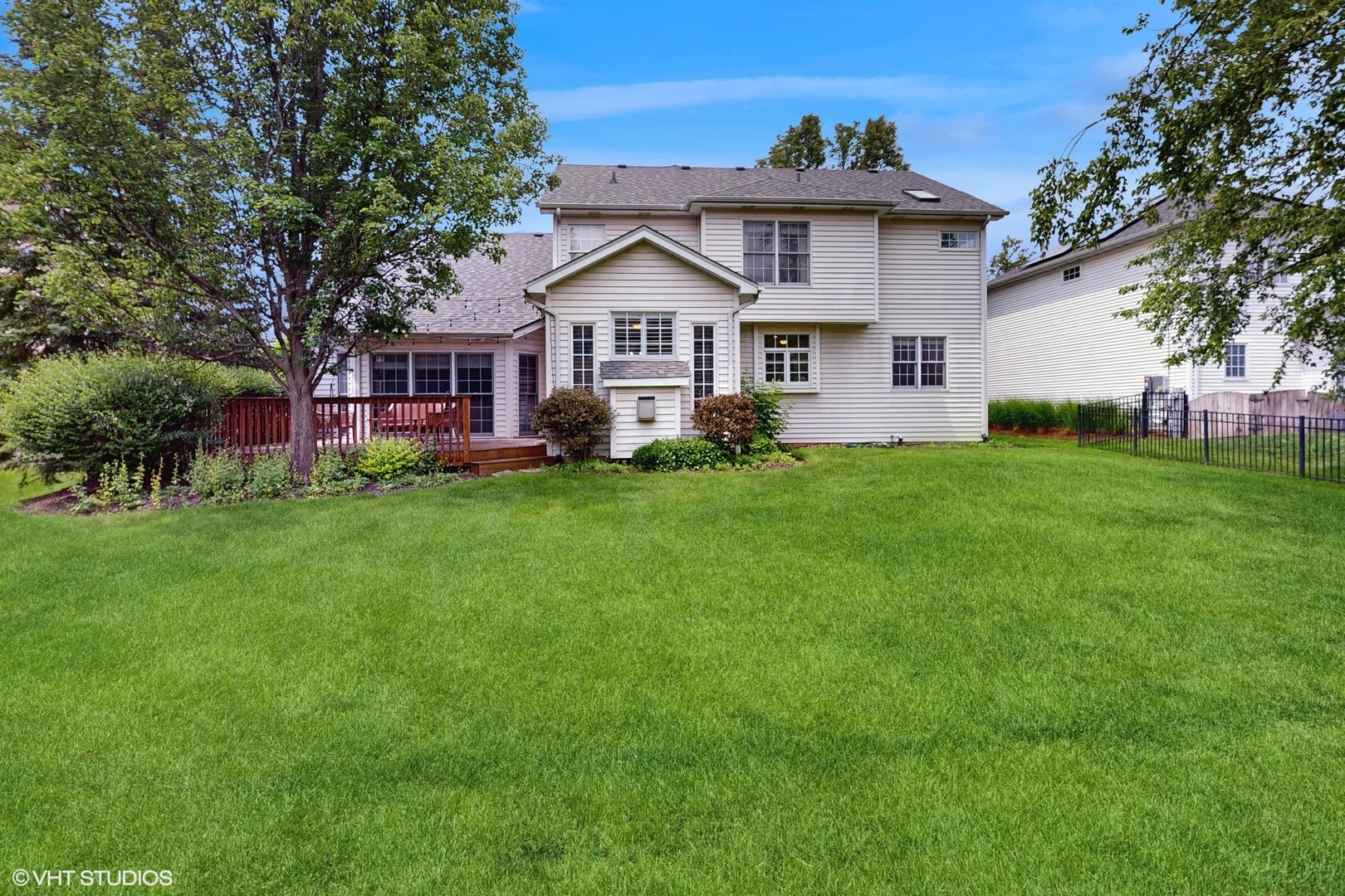 3432 Redwing Drive Naperville, IL 60564 - Photo 37 of 46 a front view of a house with a garden and trees