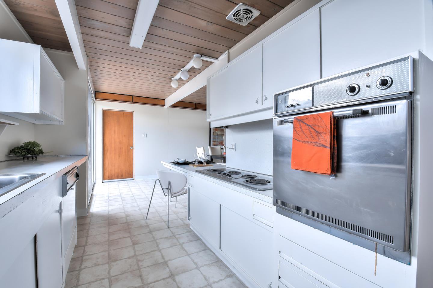 834 Constitution Drive Foster City, CA 94404 - Photo 11 of 34 a kitchen with stainless steel appliances granite countertop a stove a sink and a refrigerator