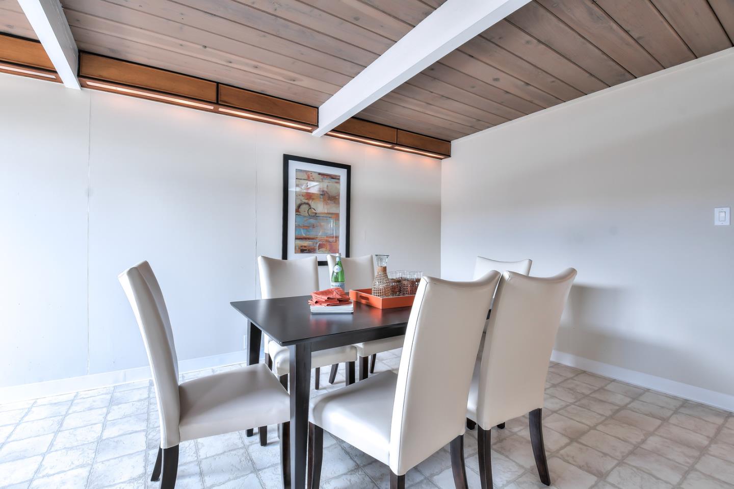 834 Constitution Drive Foster City, CA 94404 - Photo 15 of 34 a view of a dining room with furniture and wooden floor