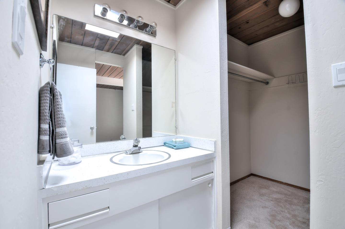 834 Constitution Drive Foster City, CA 94404 - Photo 29 of 34 a bathroom with a sink vanity granite and a mirror