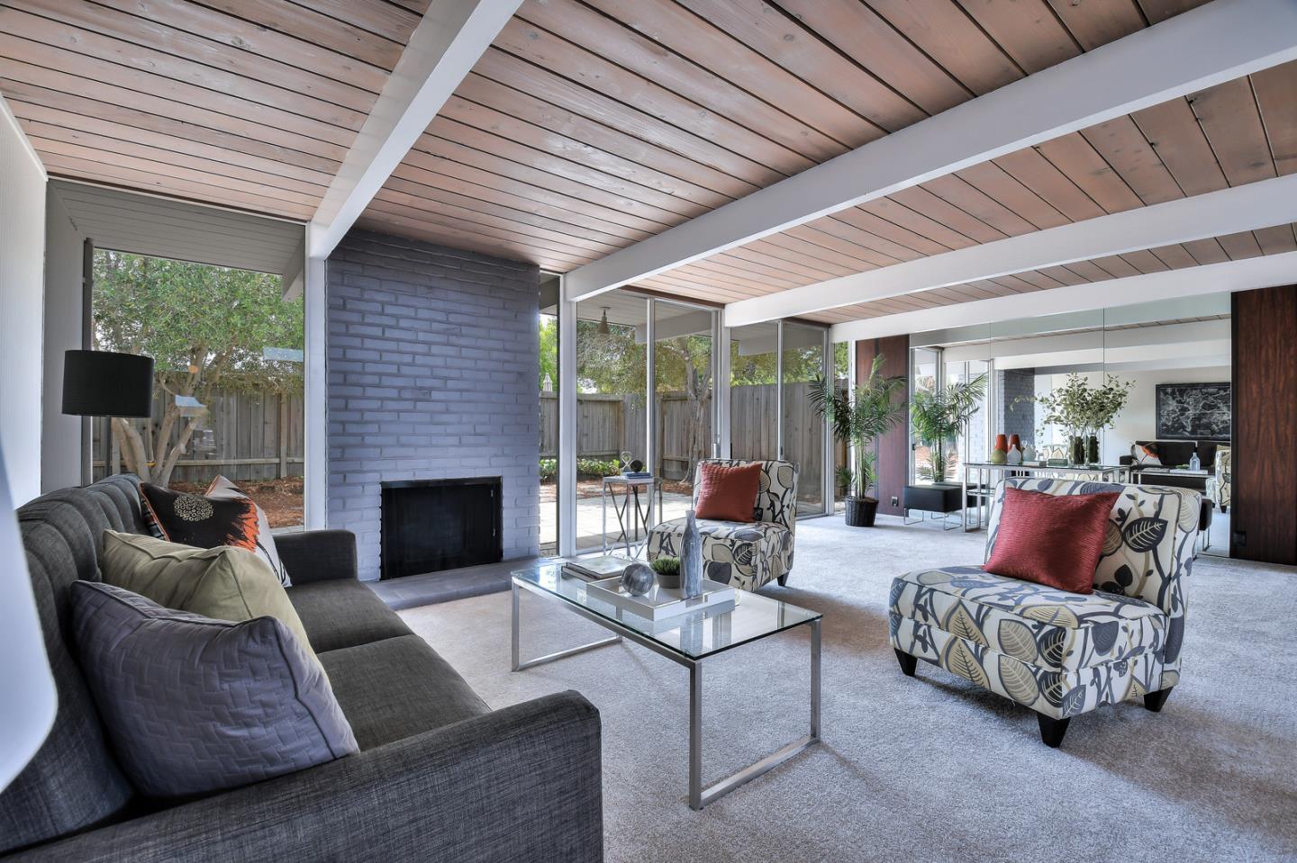 834 Constitution Drive Foster City, CA 94404 - Photo 5 of 34 a living room with furniture and a fireplace