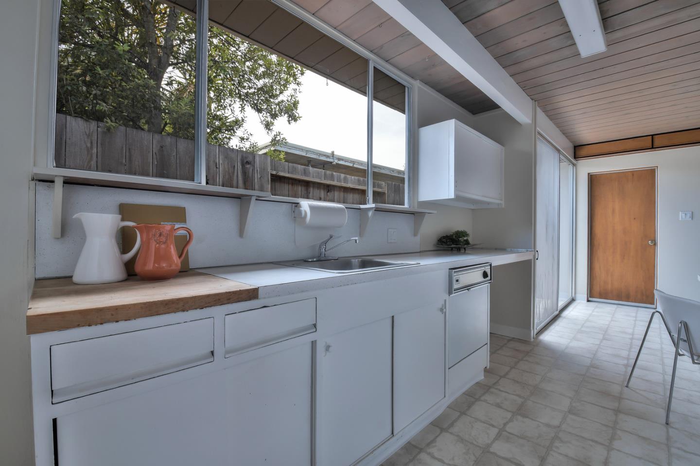834 Constitution Drive Foster City, CA 94404 - Photo 10 of 34 a kitchen with stainless steel appliances granite countertop a sink a stove and a wooden floors