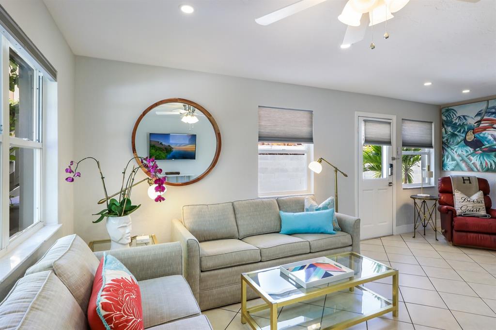 161 Golden Gate Point, Unit 1 Sarasota, FL 34236 - Photo 14 of 79 a living room with furniture and a large window