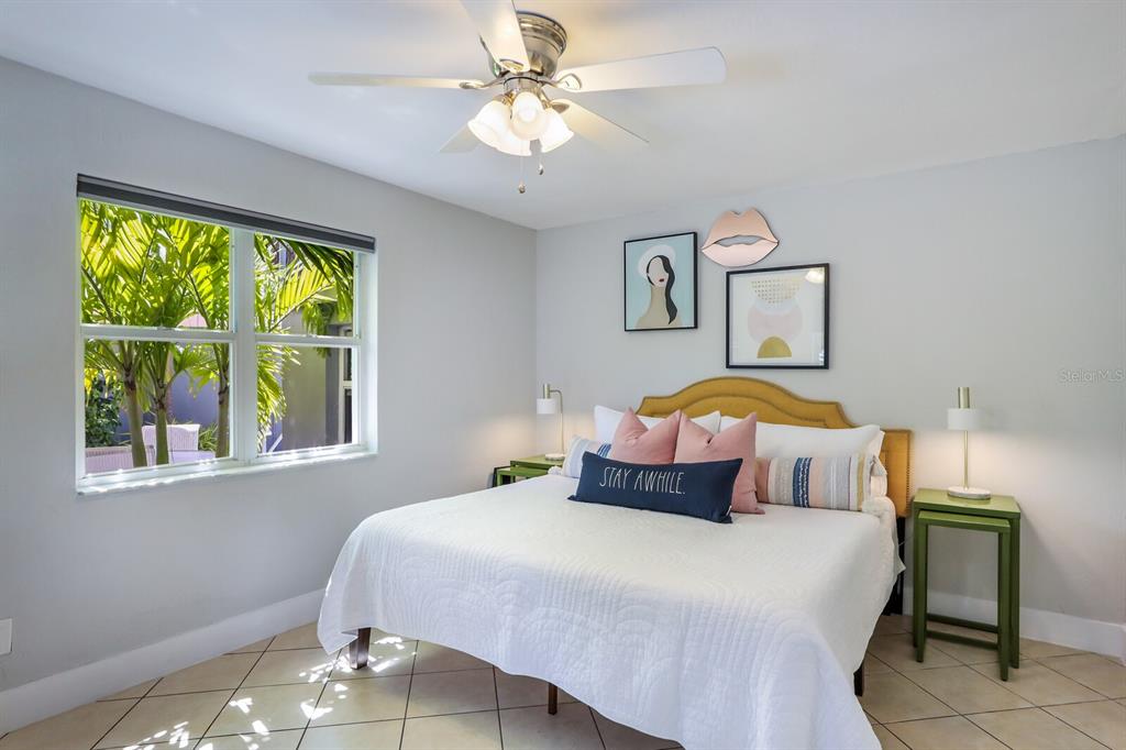 161 Golden Gate Point, Unit 1 Sarasota, FL 34236 - Photo 27 of 79 a bedroom with a bed and window