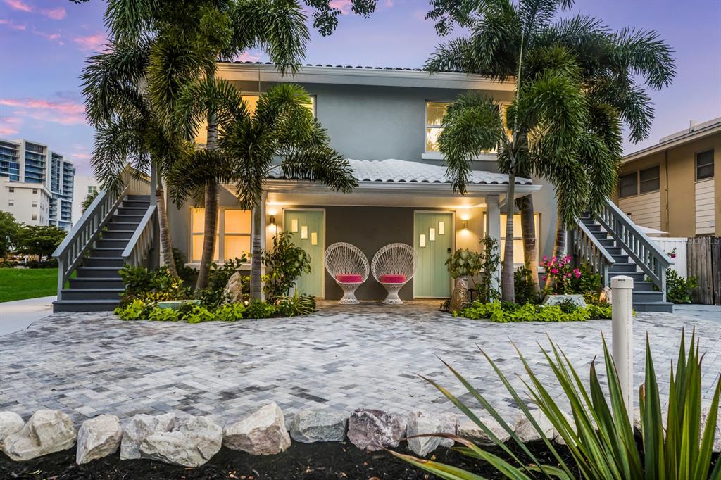 161 Golden Gate Point, Unit 1 Sarasota, FL 34236 - Photo 3 of 79 a view of a house with a yard and potted plants