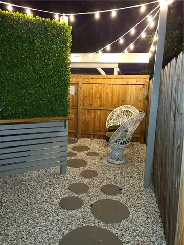 a view of outdoor space with lots of furniture and wooden floor