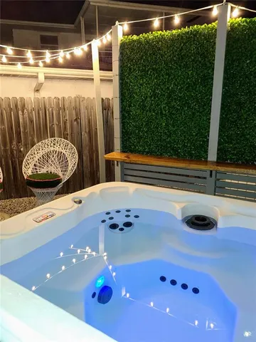 a view of a chairs and table in a backyard