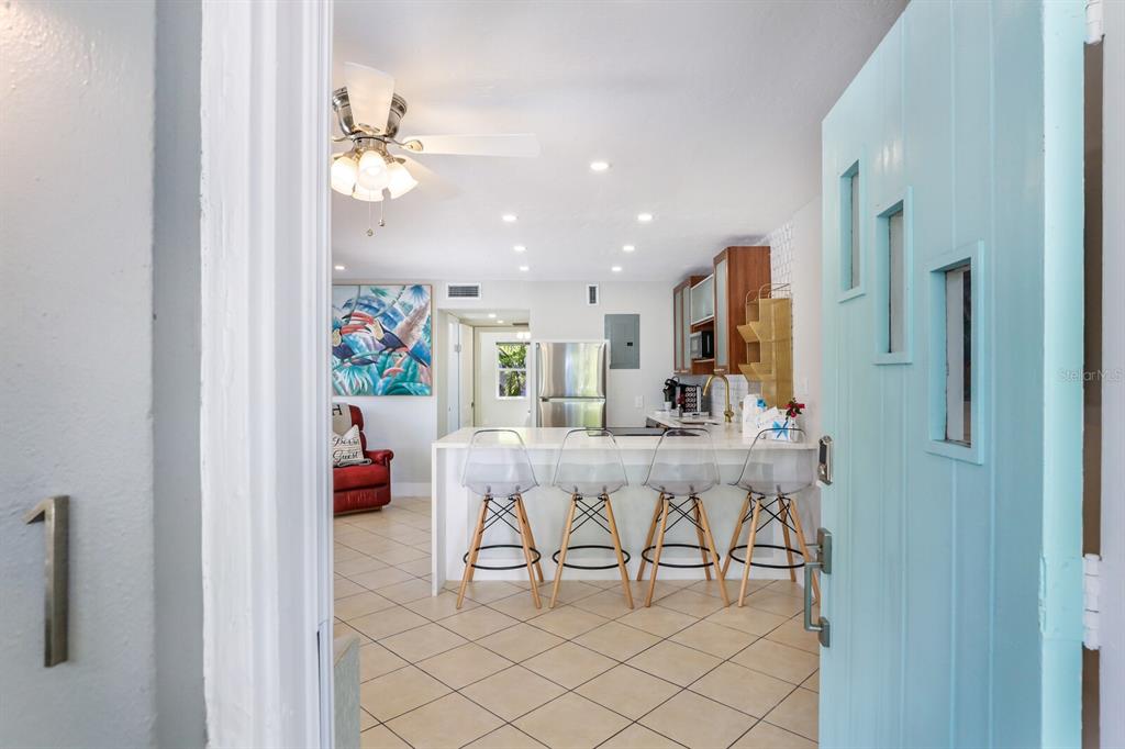 161 Golden Gate Point, Unit 1 Sarasota, FL 34236 - Photo 8 of 79 a view of a dining room with furniture and chandelier