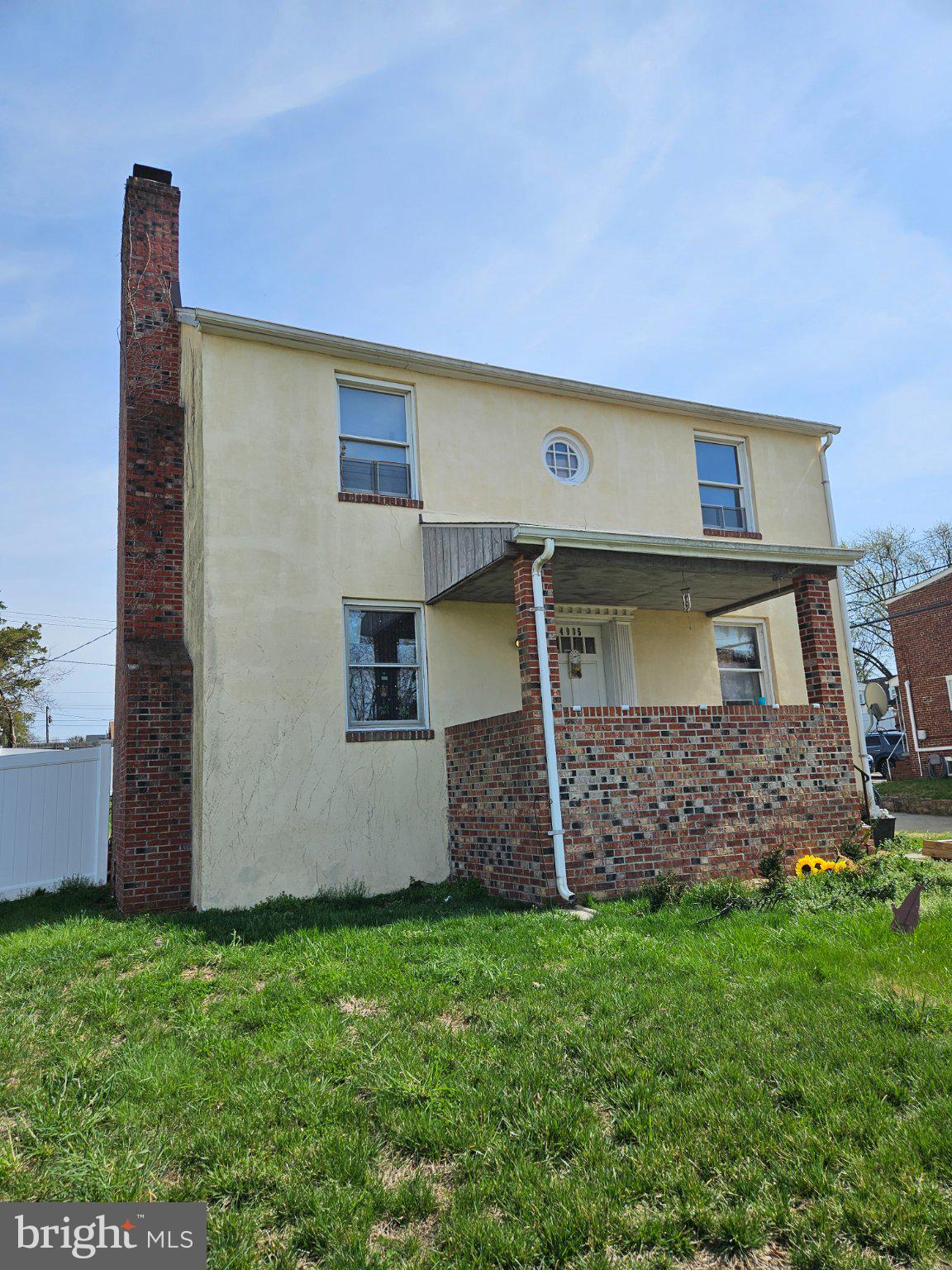 4005 3rd Street Baltimore, MD 21225 - Photo 2 of 7 a front view of a house with a garden