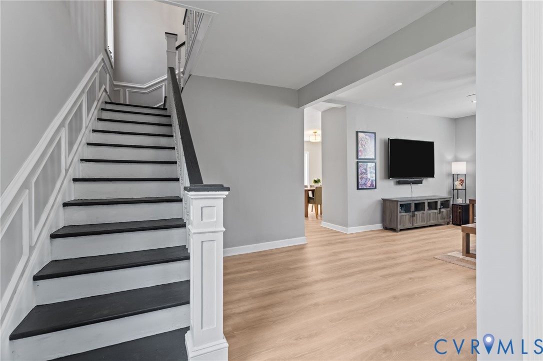 Entryway with stairway, LVP floors and coat closet