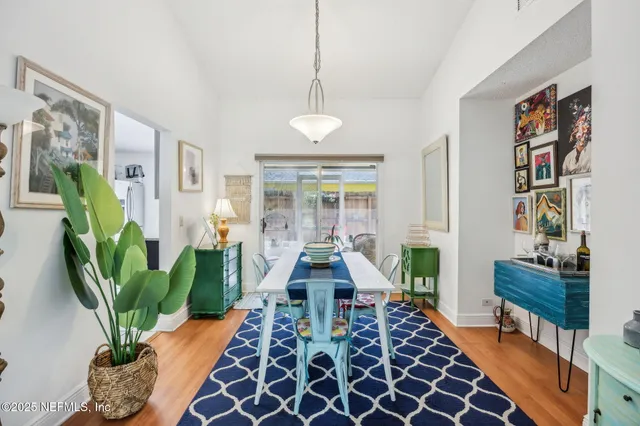 a living room with furniture potted plant and a rug