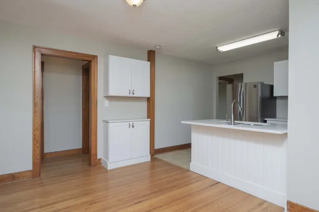 a view of a kitchen with wooden floor