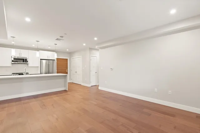 a view of kitchen with wooden floor