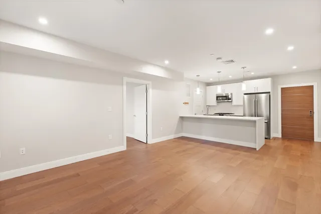 a view of kitchen with wooden floor