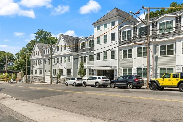 a city street lined with buildings and cars