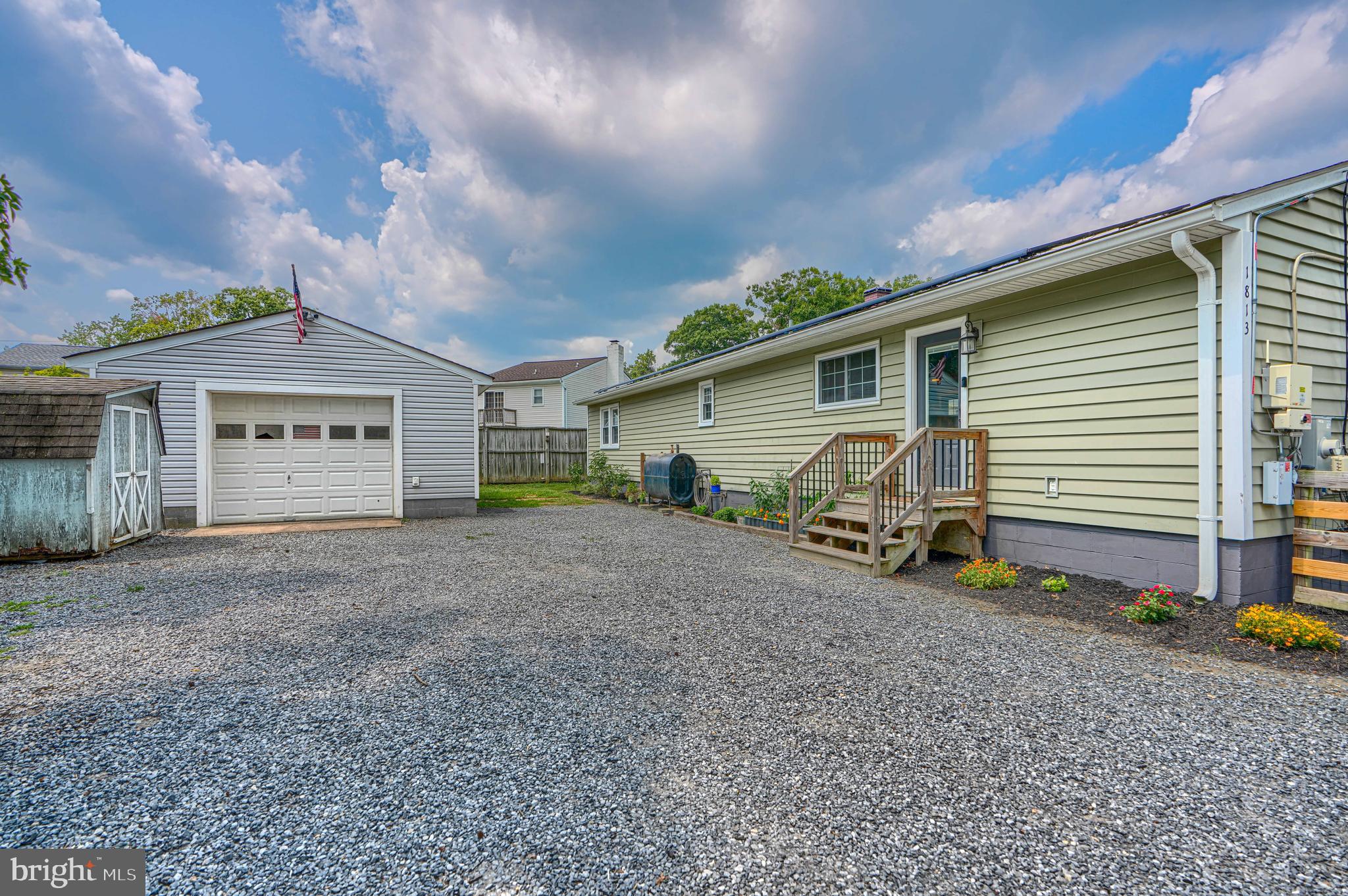 1813 Potomac Road Edgewater, MD 21037 - Photo 7 of 101 Driveway view toward garage and yard