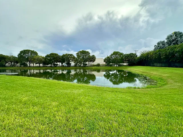 a view of a golf course with a lake