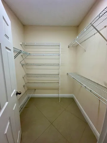 a view of an empty walk in closet