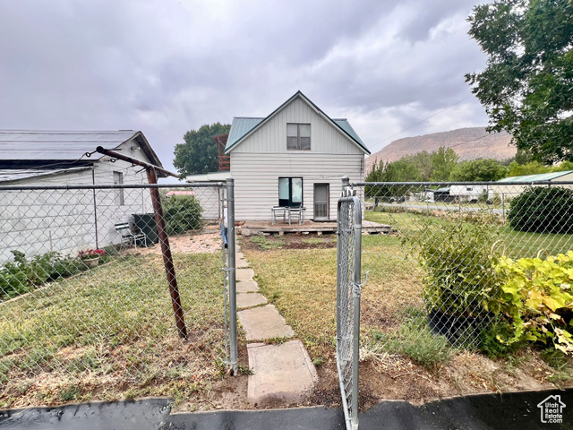 350 West Main Street Emery, UT 84522 - Photo 24 of 28 View of yard with a deck with mountain view