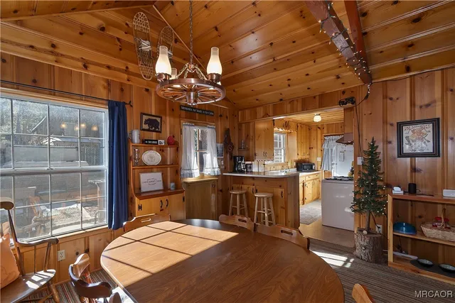 a kitchen with a sink a stove and a refrigerator