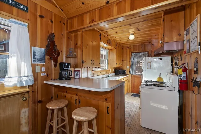 a kitchen with stainless steel appliances granite countertop a stove and a refrigerator