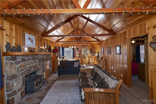 a living room with furniture a couch and a fireplace