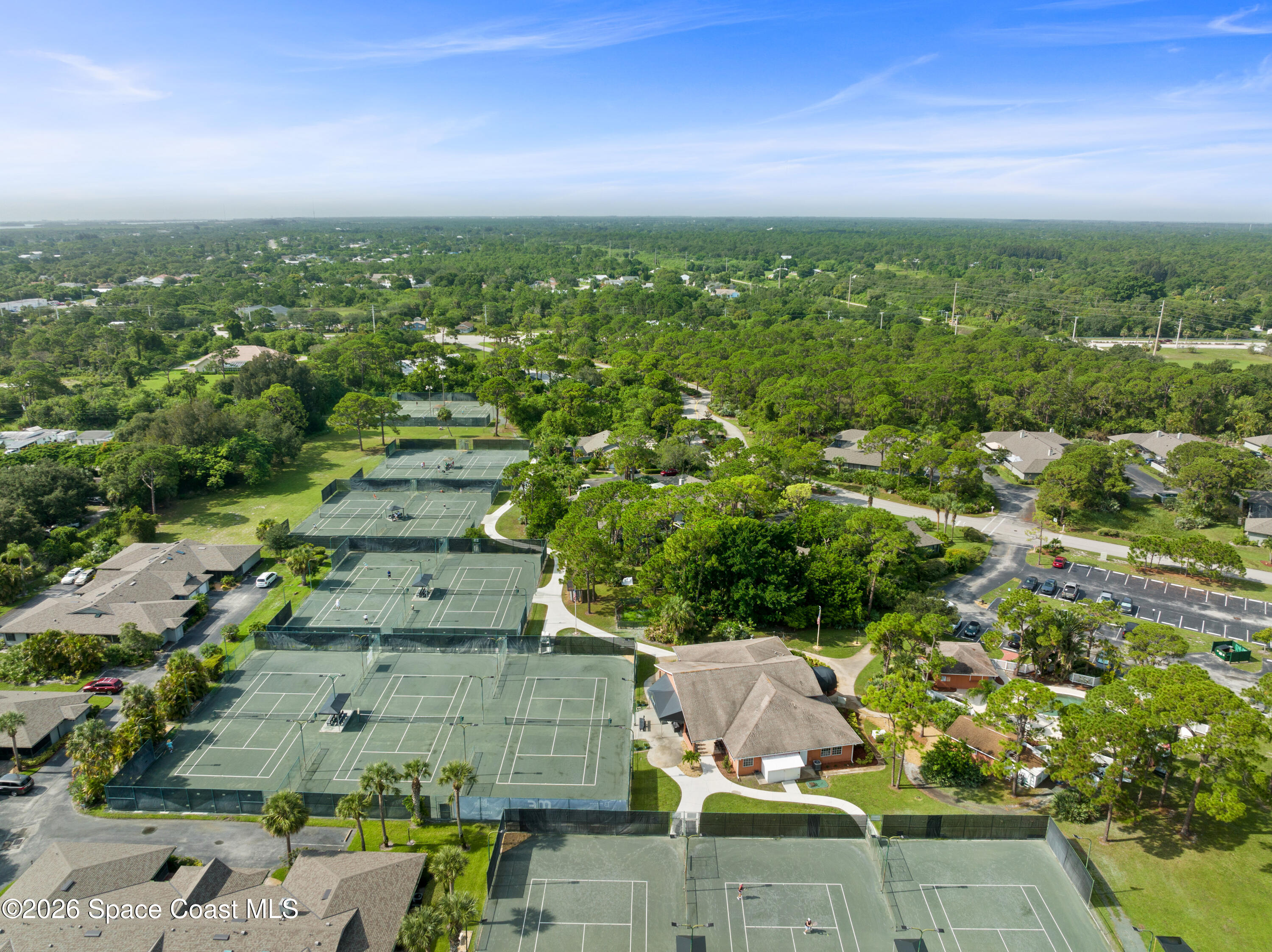 654 Centre Court Southwest, Unit 201 Vero Beach, FL 32962 - Photo 20 of 20 an aerial view of residential houses with outdoor space