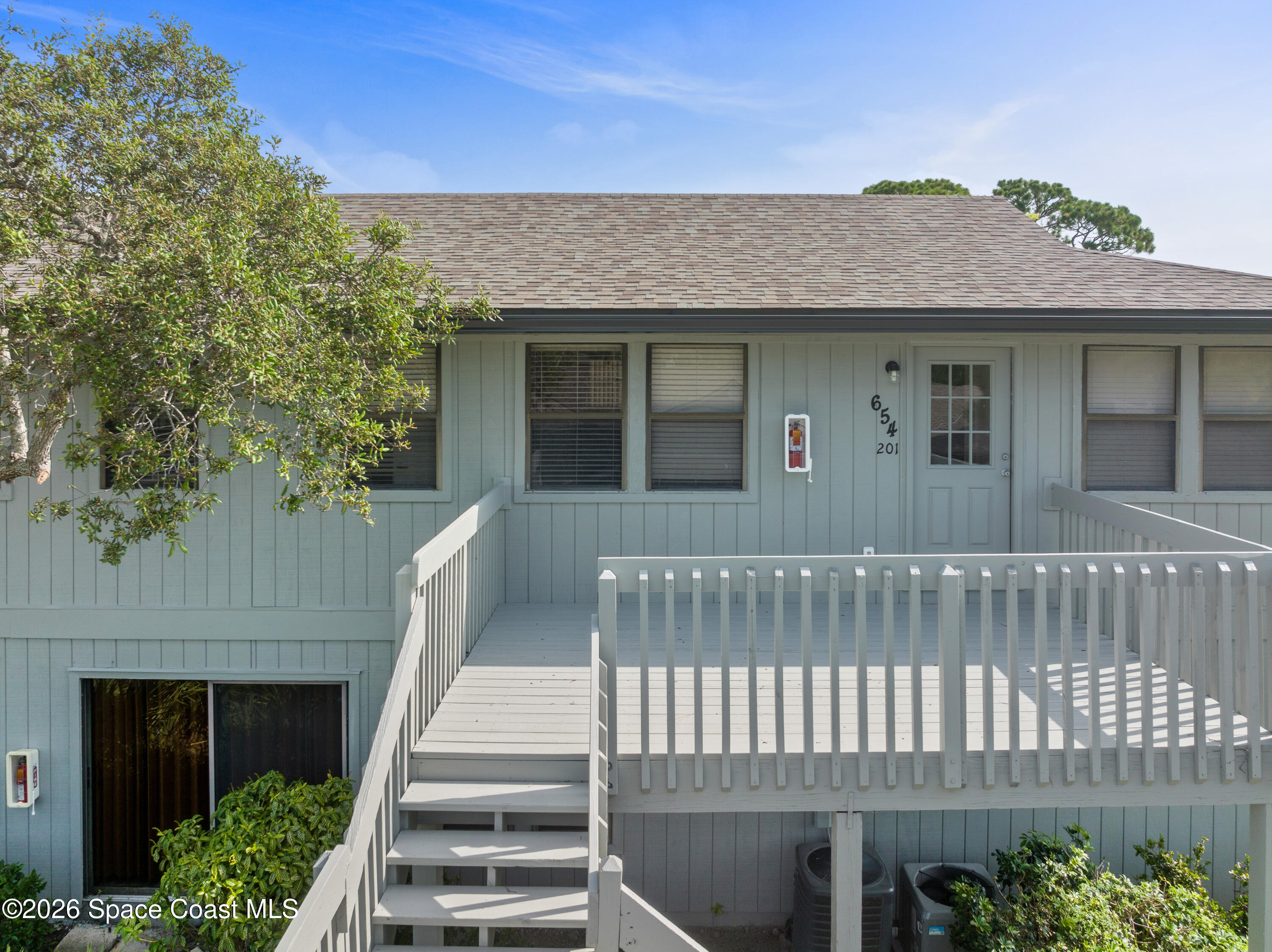 654 Centre Court Southwest, Unit 201 Vero Beach, FL 32962 - Photo 3 of 20 a view of a house with a deck