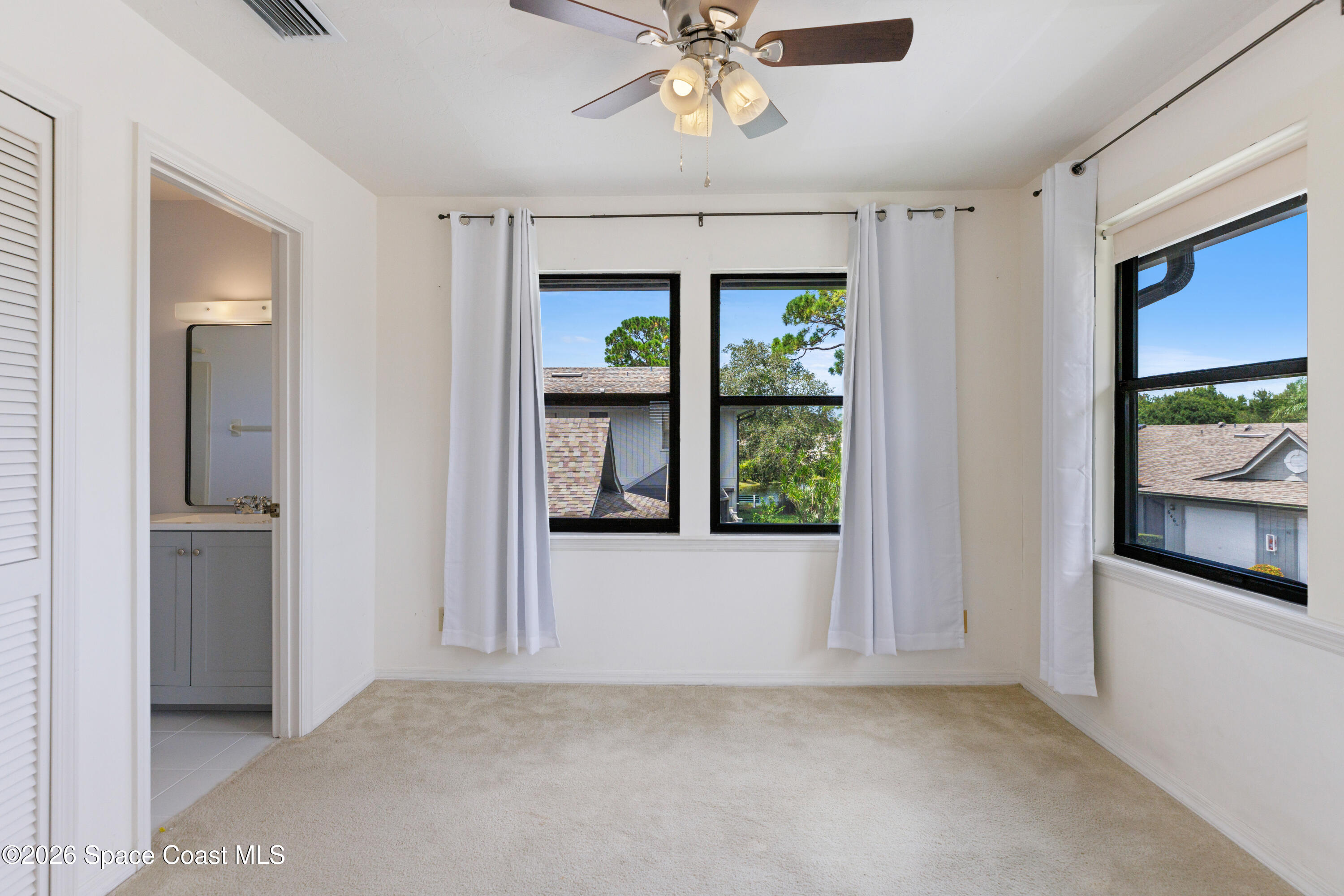 654 Centre Court Southwest, Unit 201 Vero Beach, FL 32962 - Photo 7 of 20 a view of an empty room with a window