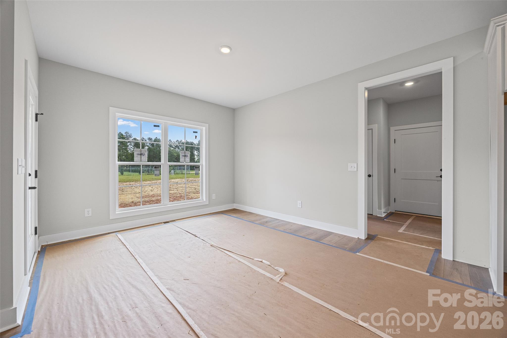 640 Edwards Road Fort Lawn, SC 29714 - Photo 9 of 39 an empty room with wooden floor and windows