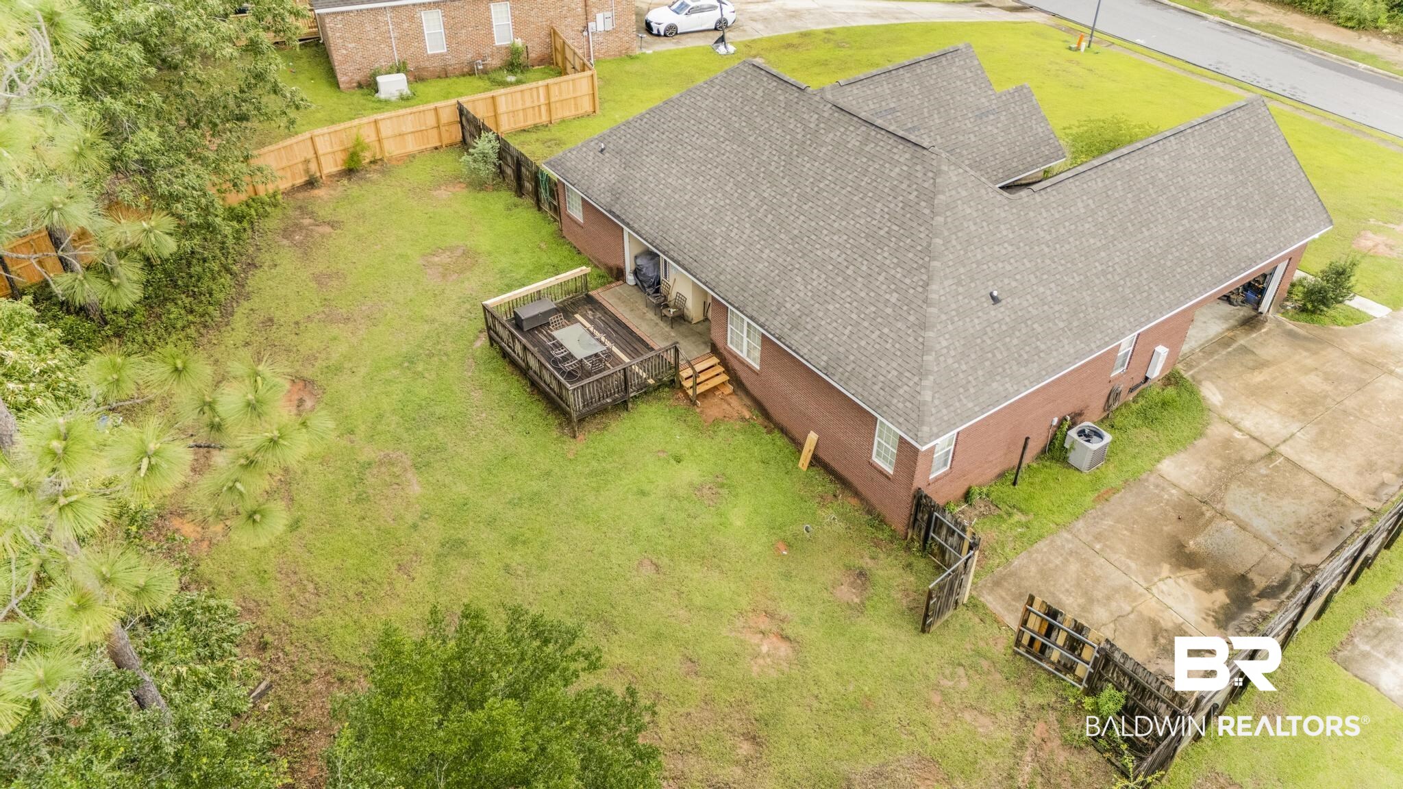 35814 Delvan Lane Bay Minette, AL 36507 - Photo 43 of 53 Brick exterior residence featuring a gray shingle roof and an attached garage