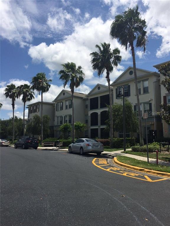 8180 Boat Hook Loop, Unit 306 Windermere, FL 34786 - Photo 1 of 1 a view of a street with houses