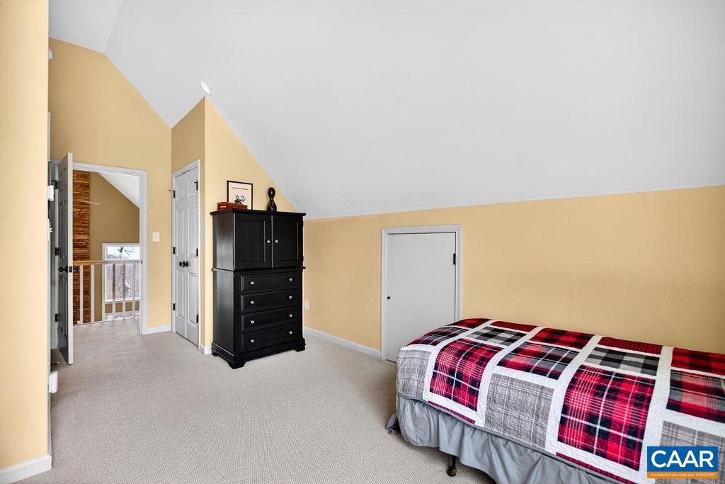 42 Peavy Point Wintergreen, VA 22967 - Photo 39 of 74 a bedroom with a bed and a walk in closet