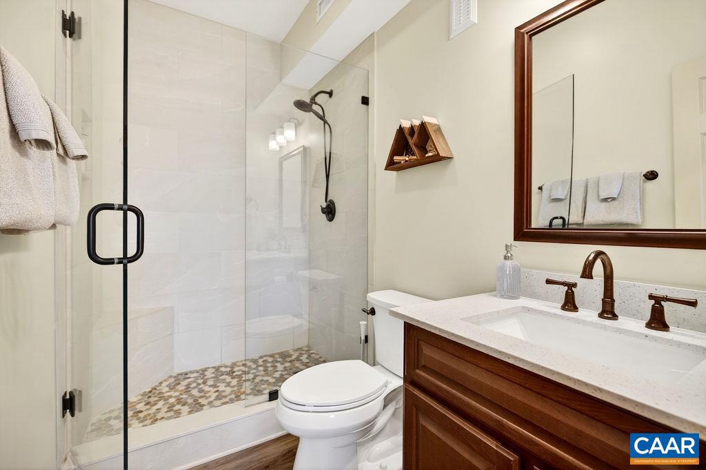 42 Peavy Point Wintergreen, VA 22967 - Photo 52 of 74 a bathroom with a sink a toilet and shower