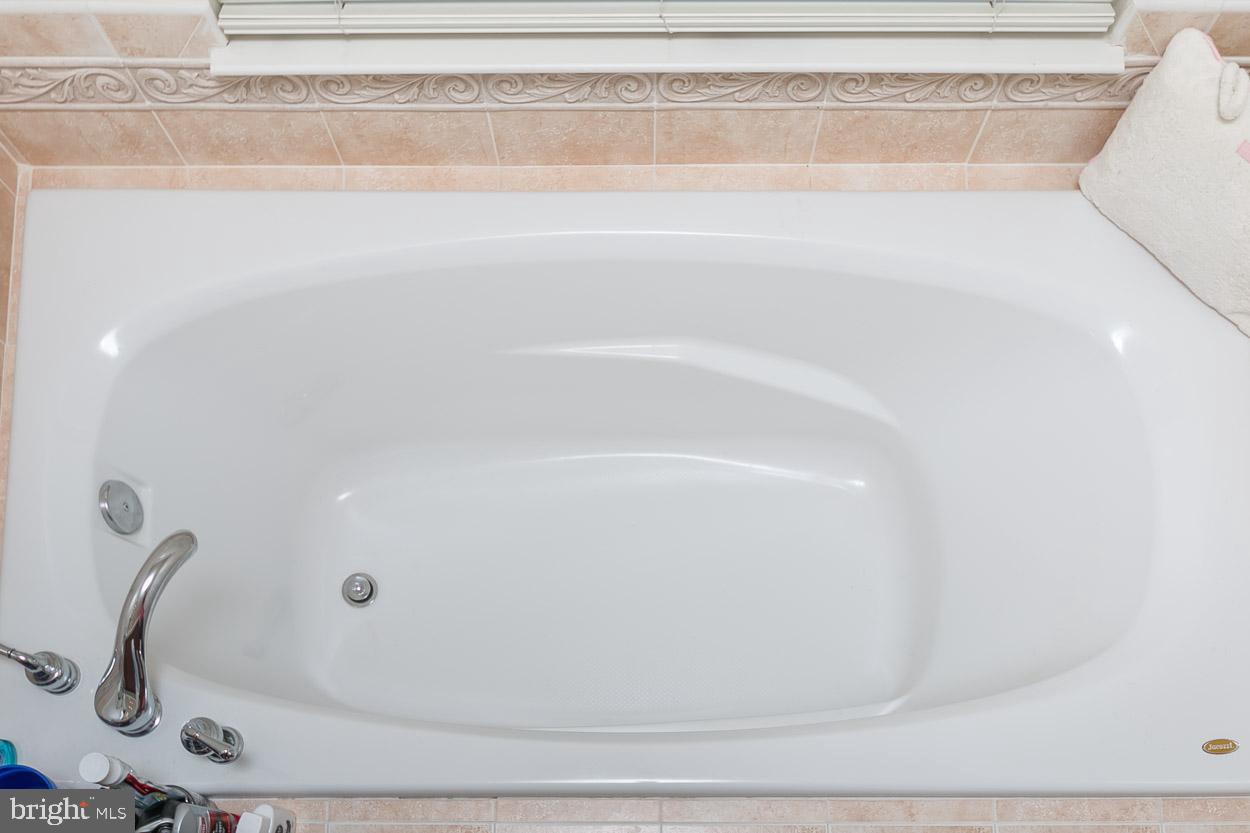 2090 Clipper Park Road Baltimore, MD 21211 - Photo 17 of 75 a bathroom with a bathtub