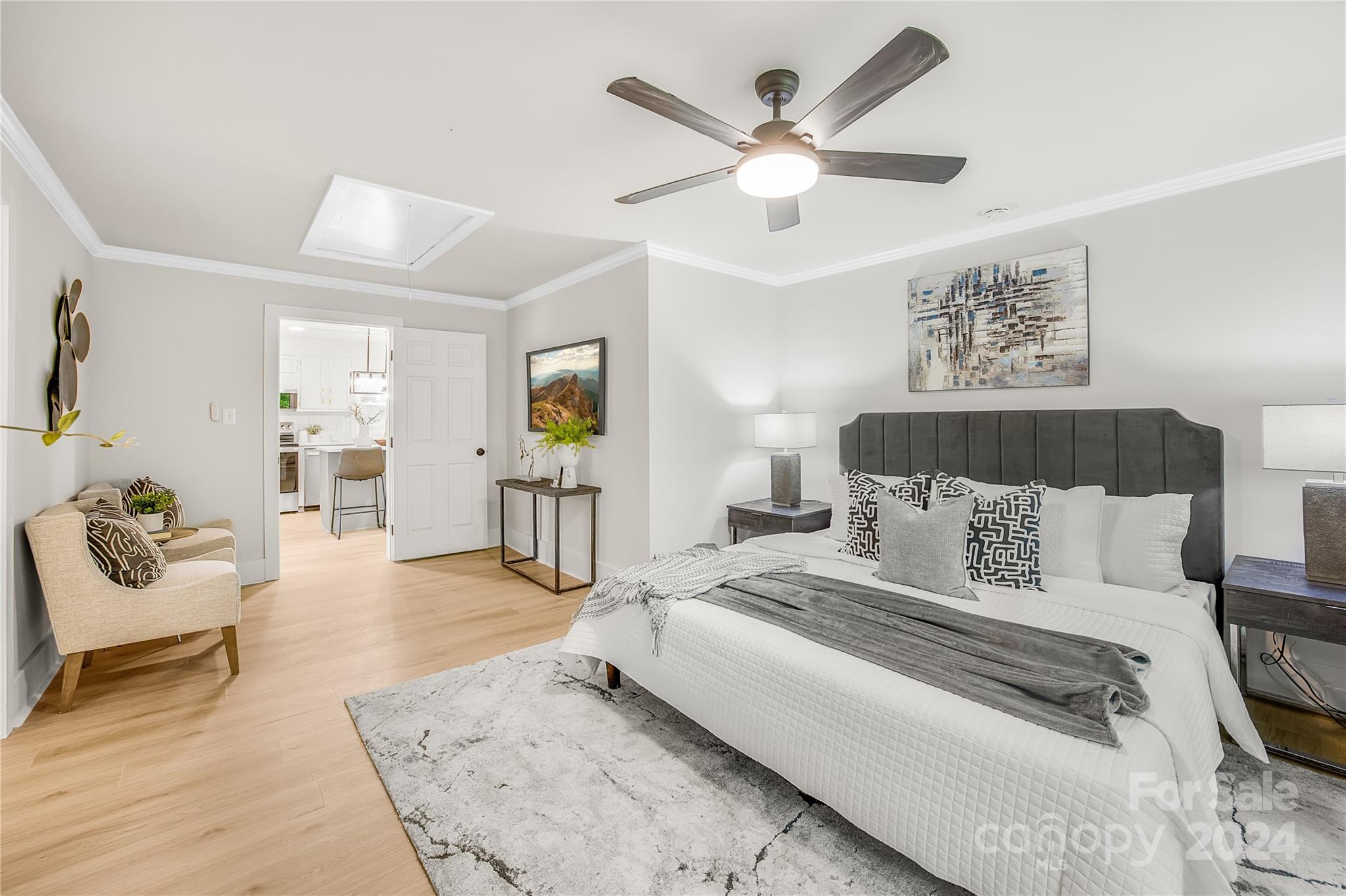 311 Roy Eaker Road Cherryville, NC 28021 - Photo 14 of 23 a spacious bedroom with a bed a couch and a chandelier