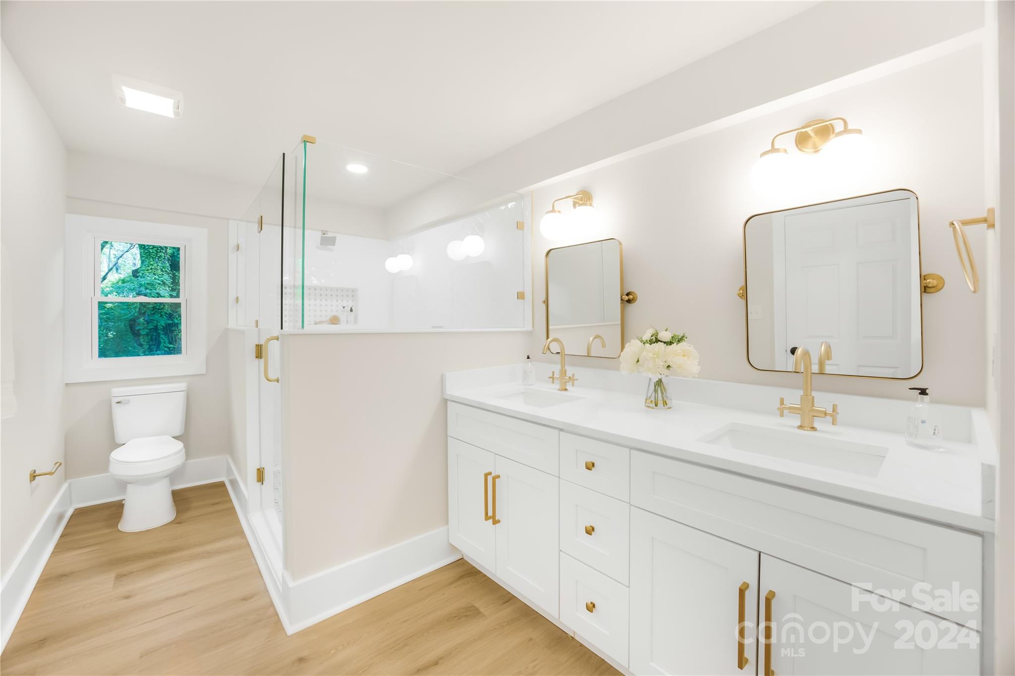 311 Roy Eaker Road Cherryville, NC 28021 - Photo 15 of 23 a bathroom with a double vanity sink mirror and toilet