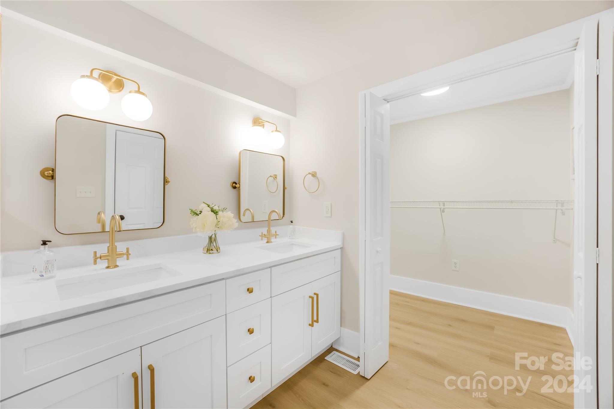 311 Roy Eaker Road Cherryville, NC 28021 - Photo 17 of 23 a bathroom with a double vanity sink and a mirror