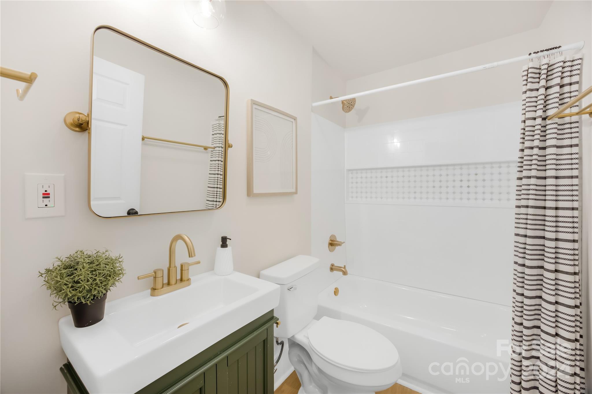 311 Roy Eaker Road Cherryville, NC 28021 - Photo 19 of 23 a bathroom with a sink toilet vanity and tub