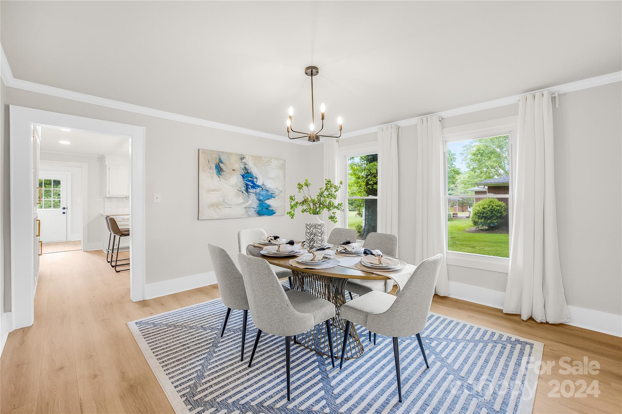 311 Roy Eaker Road Cherryville, NC 28021 - Photo 7 of 23 a dining room with furniture a chandelier and wooden floor