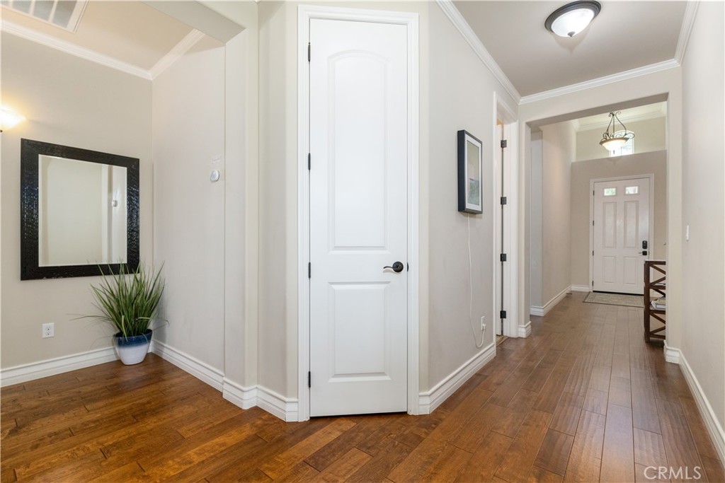 669 Red Cloud Road Paso Robles, CA 93446 - Photo 18 of 61 a view of a hallway with wooden floor and a bathroom