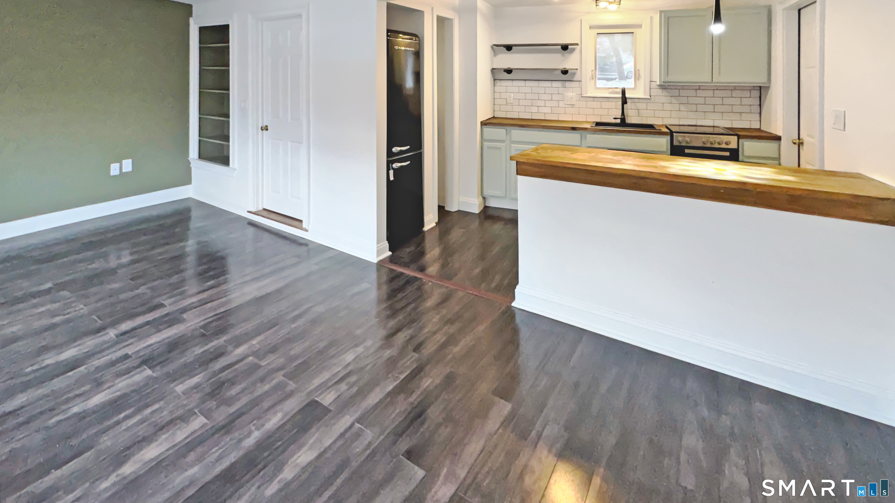 18 Riverside Avenue Westport, CT 06880 - Photo 2 of 6 a kitchen with granite countertop a sink and a stove top oven